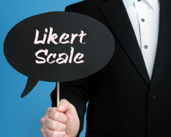 Likert Scale. Businessman holds speech bubble in his hand. Handwritten Word/Text on sign.